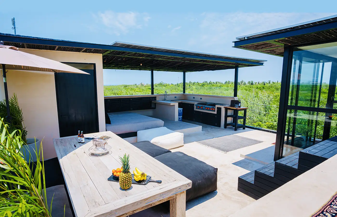 Rooftop kitchen and plunge pool at the Tulum house.